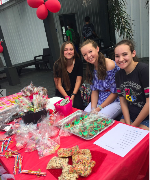 Three of Interact Club’s freshmen Reese Jones, Kirra Polley, and Grace Fields sell magical themed treats.
