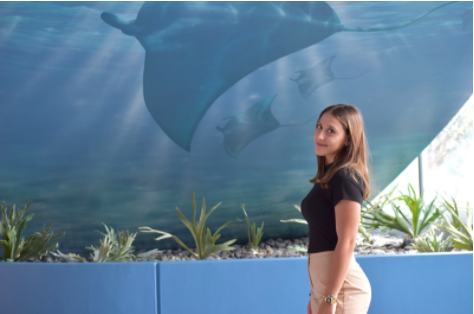 Exchange Student Claudia DePeppo in front of Manta Ray Mural 