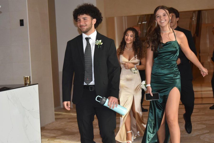Kenny Kakaty, Bella Kakaty and Ava Tobiason walking into the ballroom.