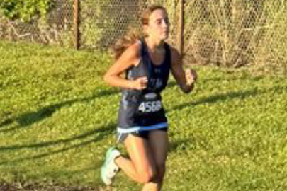 Brianna running at the Fort Myers Invite where she set her PR