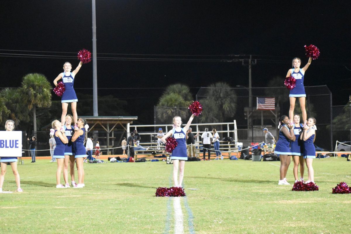 MIA cheerleaders chant during their routine for the crowd.