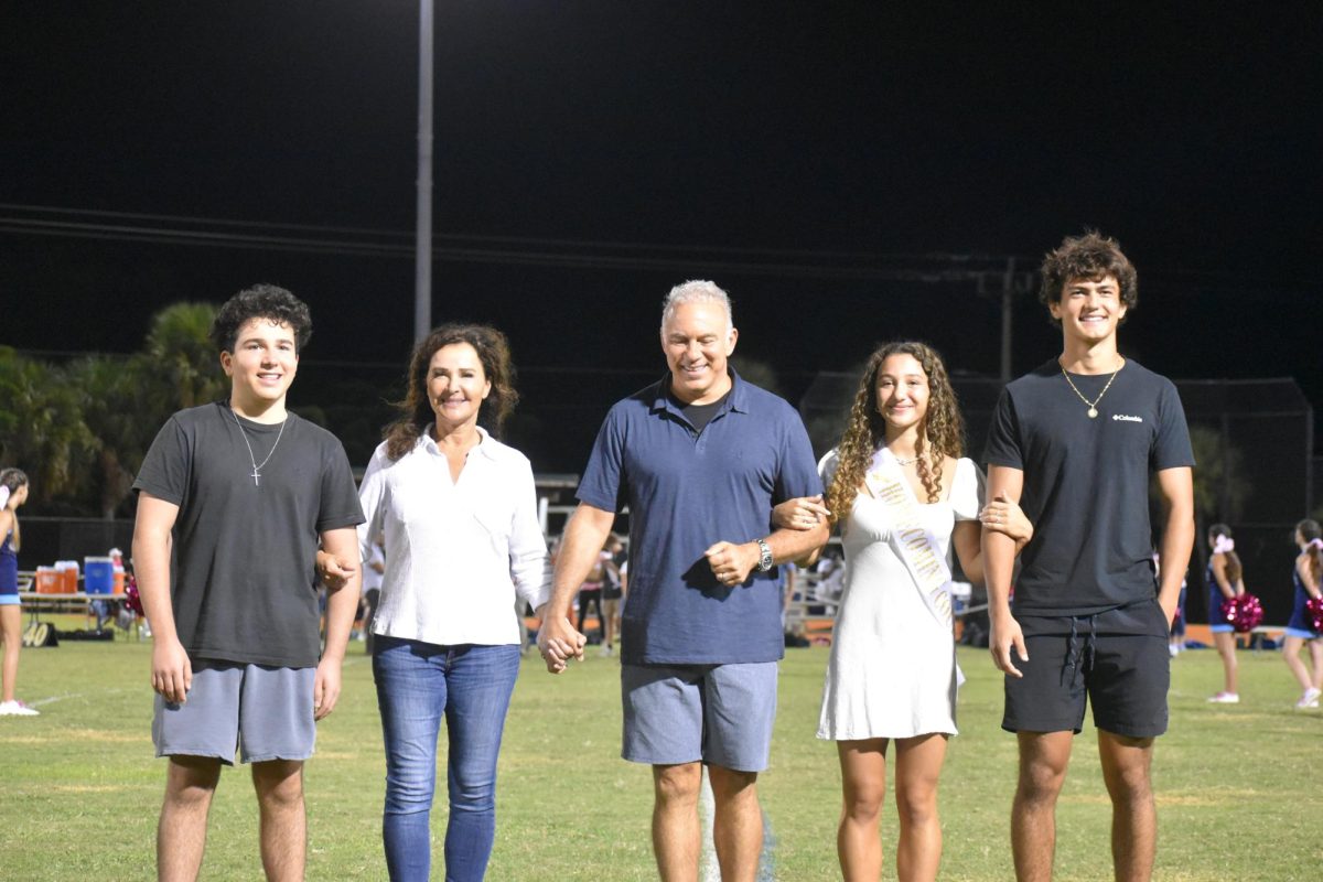 Senior homecoming court, Isabella Kakaty accompanied by her family and boyfriend.
