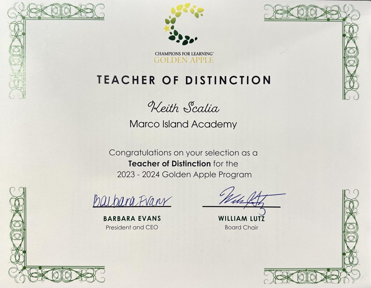 Marco Island Academy teacher Keith Scalia receives Teacher of Distinction award. (Helena Davis)