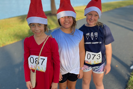 Young runners wait for the race to start dressed as elves. 