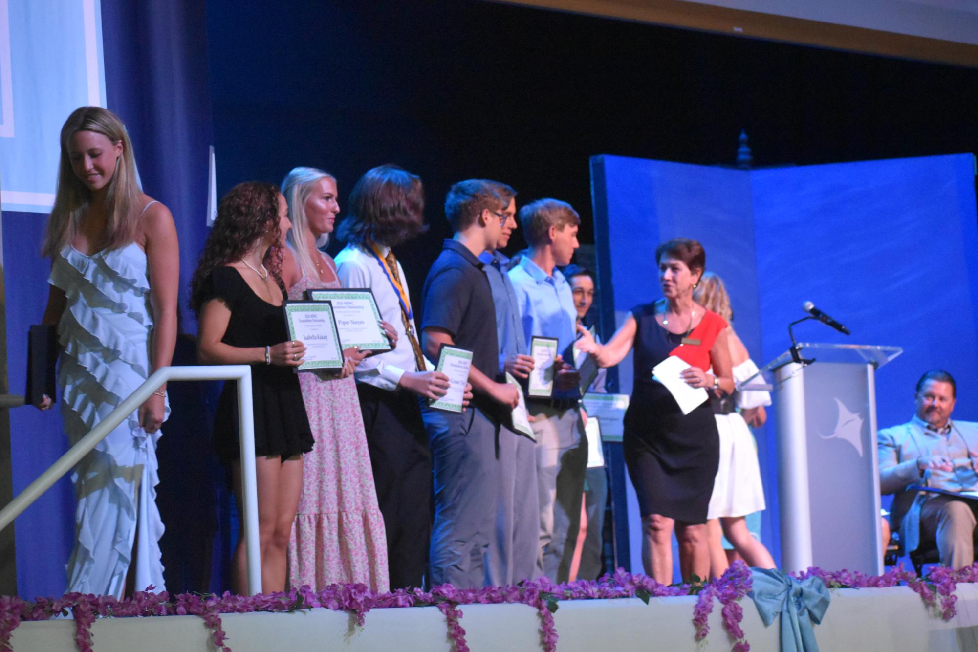 Recipients Collette Combs, Gordon Davis, Daniel Heekin, Thomas Heekin, Austin Hendrick, Makayla Hendrick, Isabella Kakaty, Piper Noyes, Celine Schauer and Grant Tirrell being congratulated for receiving the Marco Island Woman’s Club Award by presenter Anne Marchetti Marco Island Woman’s Club and MIWC president Sharyn Kampmeyer.