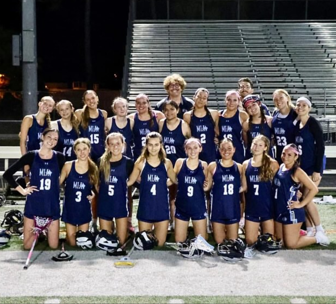The+girls+lacrosse+team+lines+up+for+a+team+picture.