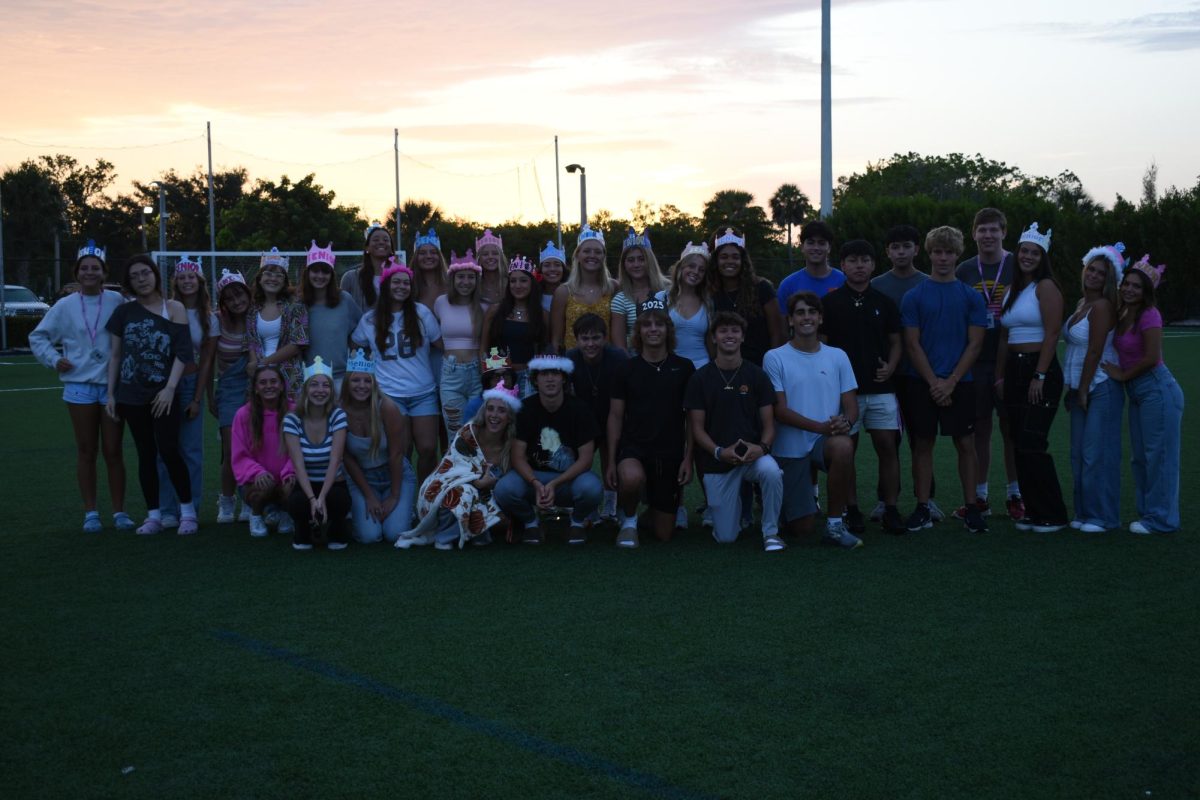 Class of 2025 gathering on the field watching sunrise, in a picture captured by Michelle Acosta.