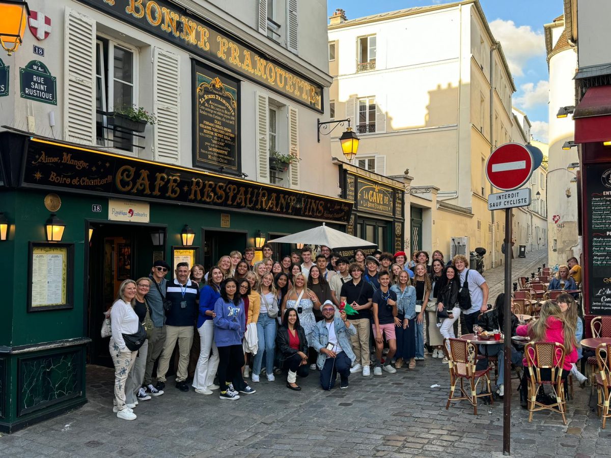 MIA Wandering Rays standing in front of their first stop in Paris. 