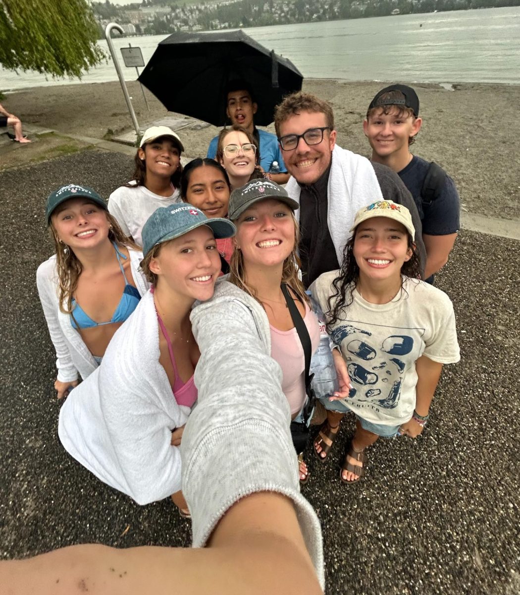 Students and staff warming up after a cold dip in Lake Lucerne.