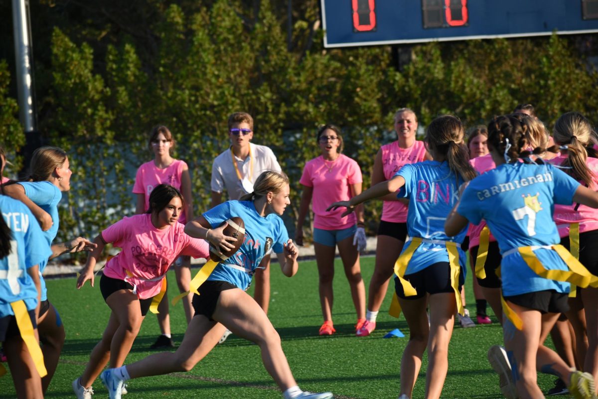 Blue team guarding and protecting Gracie Johnson from the pink team.