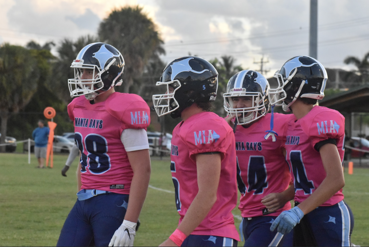 Sean McGowan, Gavin Montgomery, Matthew Asbell, and Zac Massie stepping out onto the field.