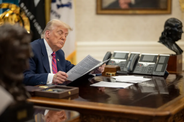 President Donald J. Trump signs S.1852, the GENIUS Act. Photo Credits: The White House.