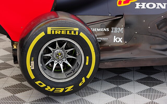 Pirelli Tire on a Red Bull car. [A Red Bull RB8 F1 car in the paddock at Brands Hatch.] by [Matt Buck] is licensed under [https://creativecommons.org/licenses/by-sa/2.0/deed.en]