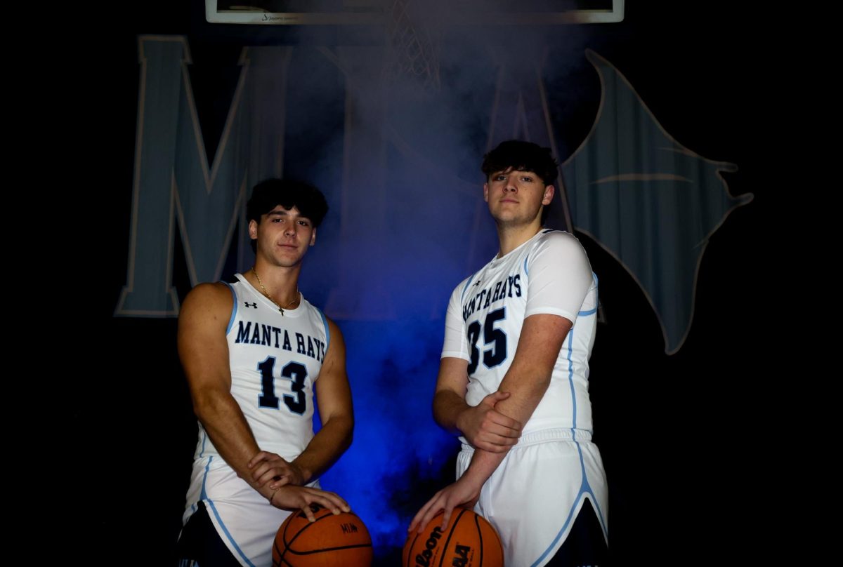 Captain Veleon Nazarko and Junior Cade Martin taking a picture during media day. 