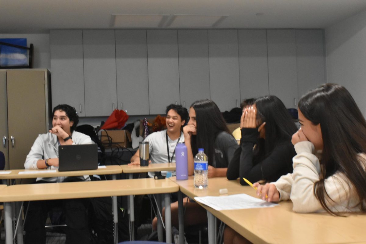 English students filled with laughter watching "That 20's Show" project