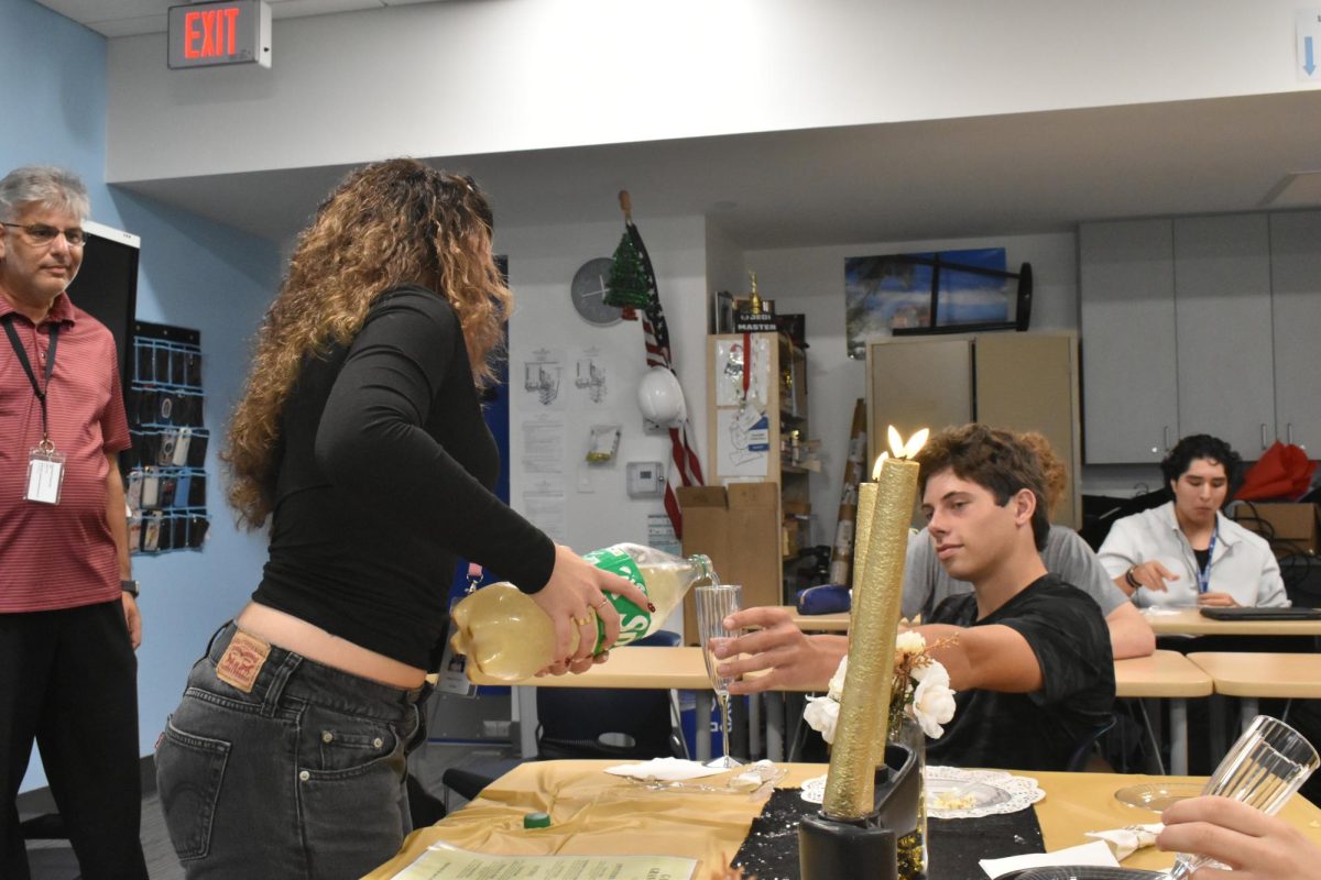 Fonseca serving glittered Sprite to Reid Baur