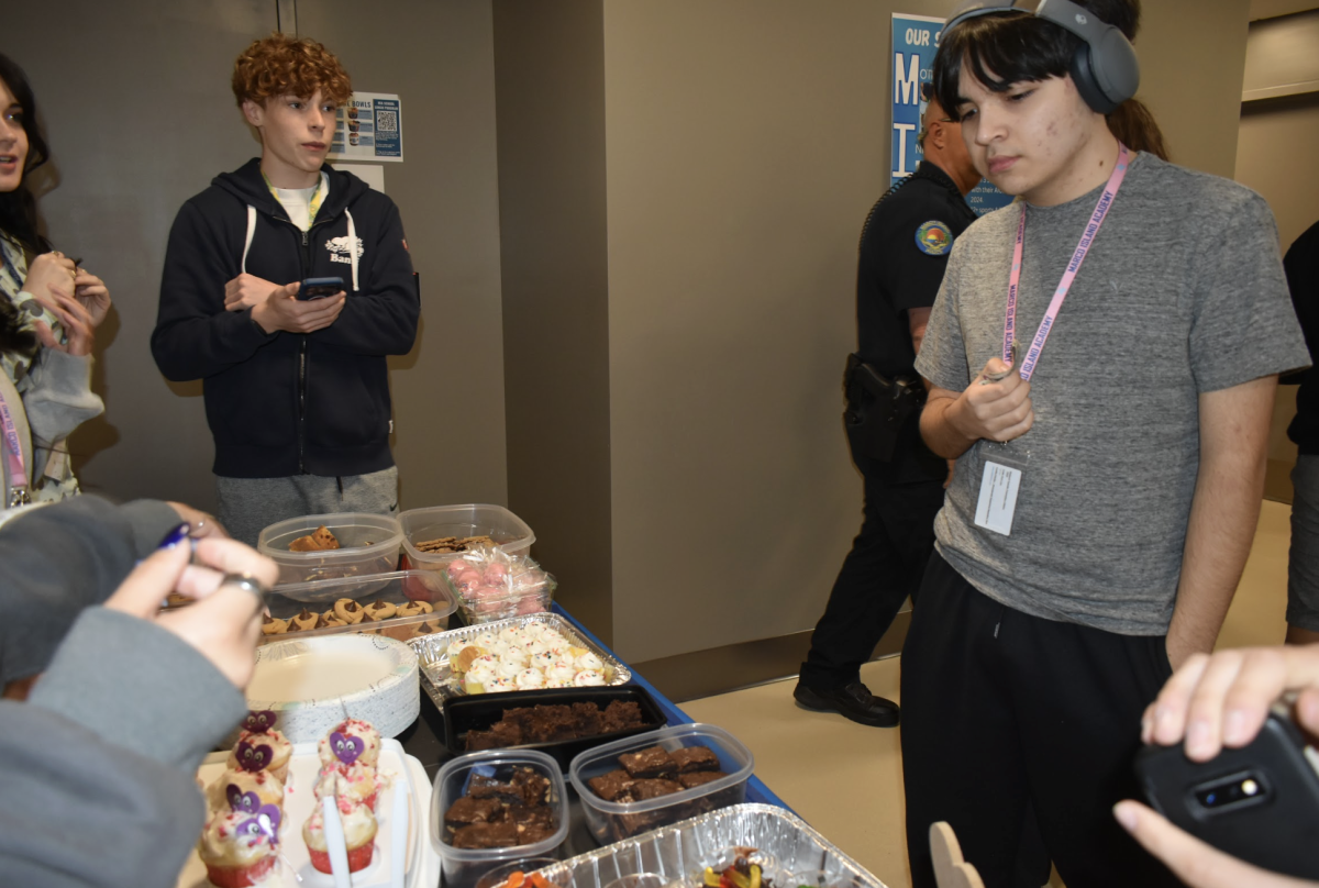 Students at MIA picking items from the St. Baldricks Bake Sale. 