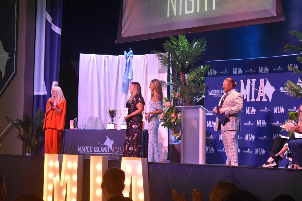 Julia Berger and Bianca Fernandes receiving applause for their scholarship.