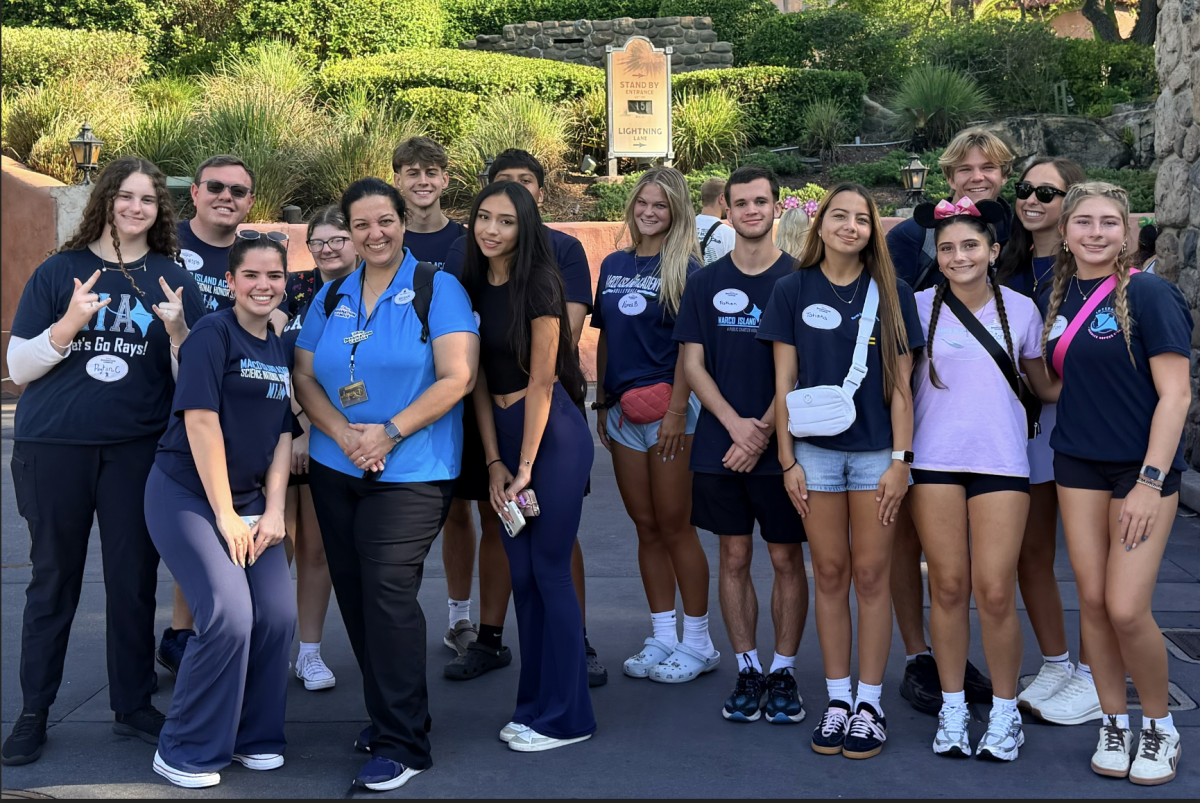 Mr. Swope’s group taking a quick picture with their workshop employee before continuing with their educational tour.